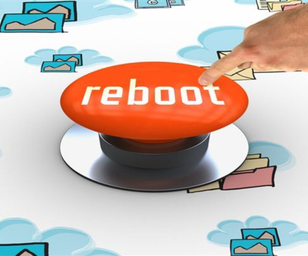 Finger pressing Reboot Button